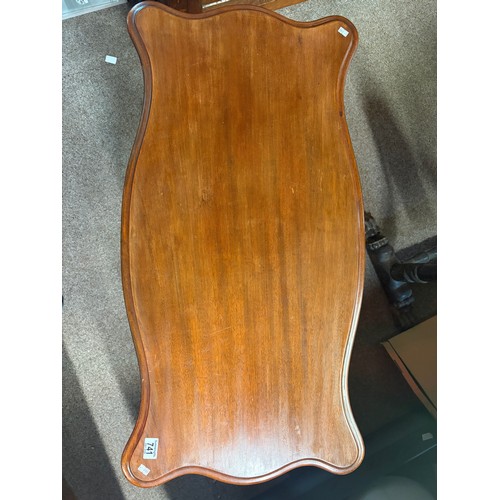 613 - An antique mahogany hall table of serpentine outline on heavily carved supports 96cm wide x 50cm dee... 