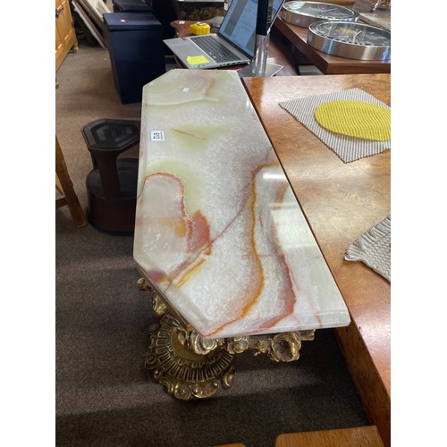 612 - A gilt and onyx console table, the support moulded as a cherub, 82.5cm, 30cm deep, 81cm high