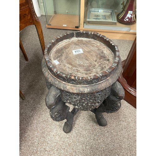 594 - A 19th century Anglo-Indian jardiniere stand, the heavily carved legs formed as elephants 51cm high,... 