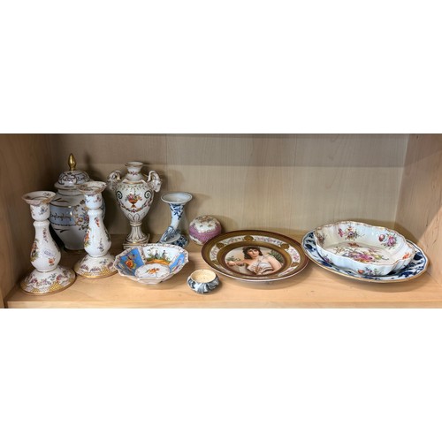 324 - A selection of porcelain items including urns, candlesticks, trinket boxes, plates and bowls.  By ma... 