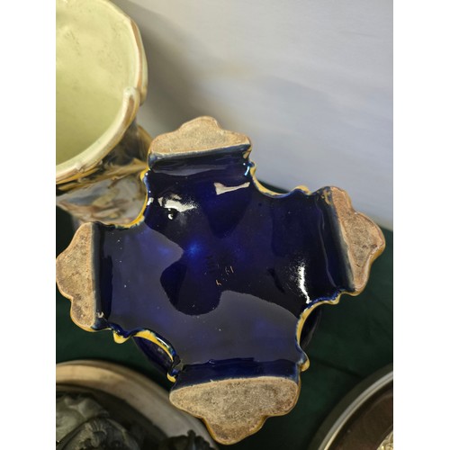 43 - A Pair of Blue and Gold Italian-style porcelain vases painted with flowers and cherubs and gilded Ro... 