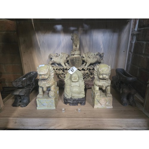 57 - six carved soapstone figures including an incense burner, buddha, foo dogs etc