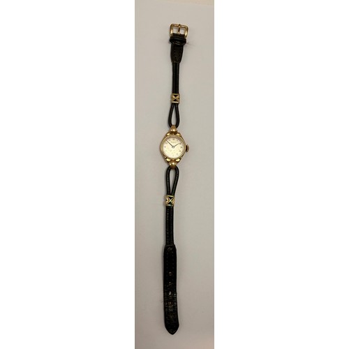 446 - A lady's 9 carat gold-cased wristwatch, the circular dial signed Rotary, with gilded Arabic numerals... 