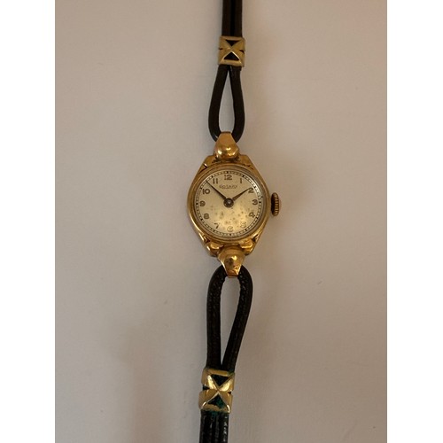 446 - A lady's 9 carat gold-cased wristwatch, the circular dial signed Rotary, with gilded Arabic numerals... 