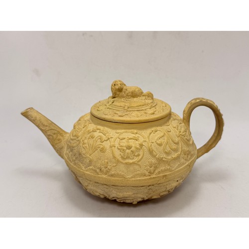58 - A Wedgwood caneware teapot, early-mid 19th Century, with moulded floral decoration, the cover with s... 