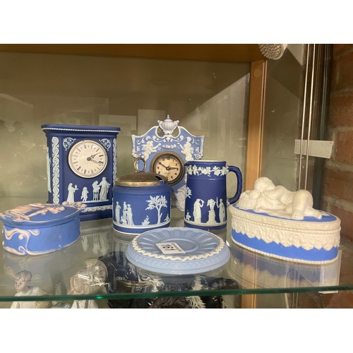 161 - A collection of Jasperware, including a Wedgwood mantel clock, sugar bowl, jug and dish
