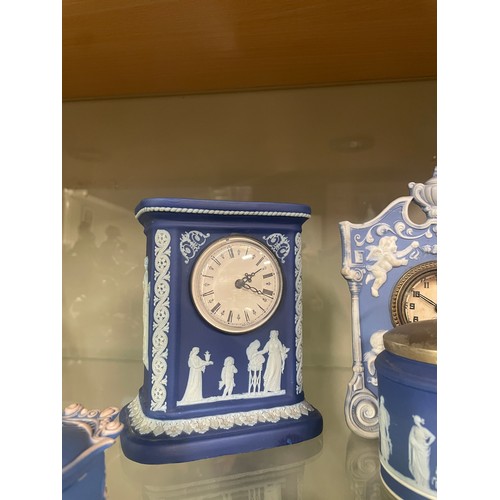 161 - A collection of Jasperware, including a Wedgwood mantel clock, sugar bowl, jug and dish