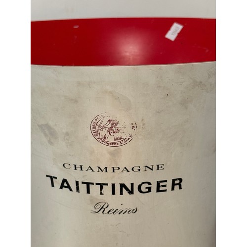 337 - A large 'Champagne Taittinger Reims' champagne bucket, with red interior. 36cm diameter