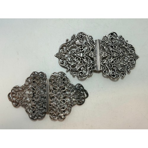 359 - Two late Victorian silver nurse's belt buckles, the first by G W Harvey & Co, Birmingham 1897, cast ... 
