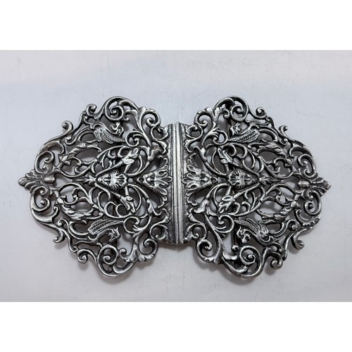 359 - Two late Victorian silver nurse's belt buckles, the first by G W Harvey & Co, Birmingham 1897, cast ... 