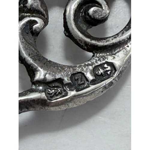 359 - Two late Victorian silver nurse's belt buckles, the first by G W Harvey & Co, Birmingham 1897, cast ... 