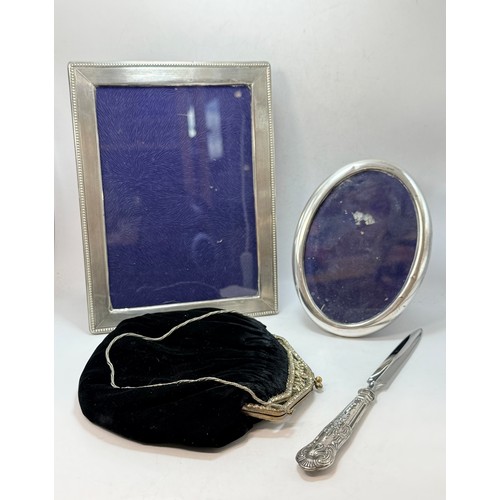366 - An Elizabeth II silver-handled letter opener by Harrison Brothers (probably), Sheffield 1978; togeth... 