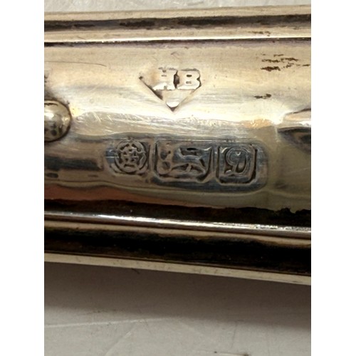 366 - An Elizabeth II silver-handled letter opener by Harrison Brothers (probably), Sheffield 1978; togeth... 