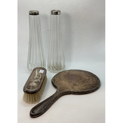 373 - A pair of Edwardian silver-collared vases by Schindler & Co, London 1909, the tall glass bodies flut... 