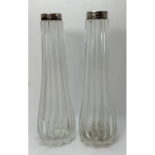 373 - A pair of Edwardian silver-collared vases by Schindler & Co, London 1909, the tall glass bodies flut... 