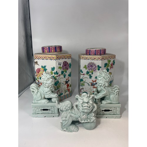 506 - A pair of early 20th century famille rose lidded jars, enamelled with birds and flowers, bearing red... 