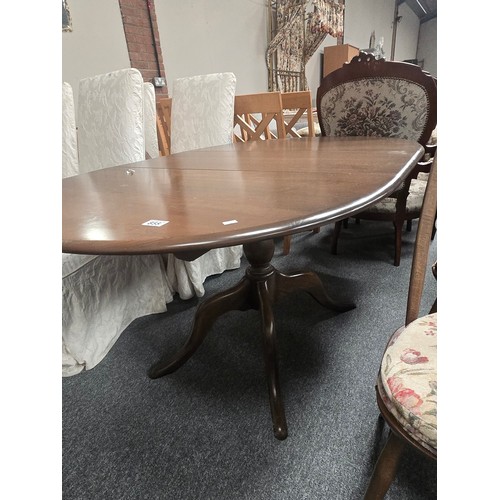 855 - A Vintage Ercol dark wood extendable Dining table and four Quaker swan chairs