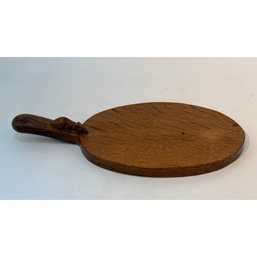 235 - A Robert Mouseman Thompson adzed oak cheeseboard, the handle with carved mouse, 38cm wide