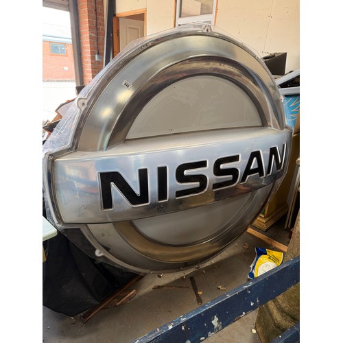 946 - A large Nissan car showroom advertising logo. 173cm wide overall