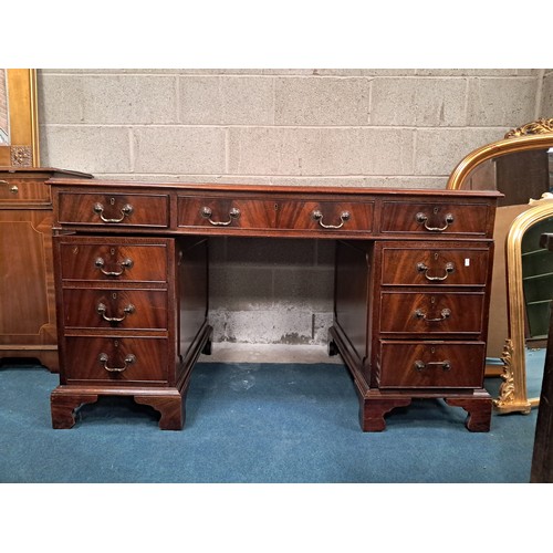 1026 - Antique Mahogany pedestal writing desk with brown leather writing surface and nine drawers with bras... 