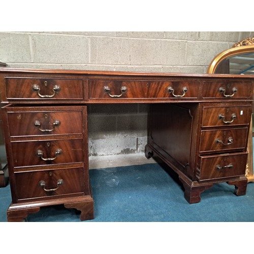 1026 - Antique Mahogany pedestal writing desk with brown leather writing surface and nine drawers with bras... 