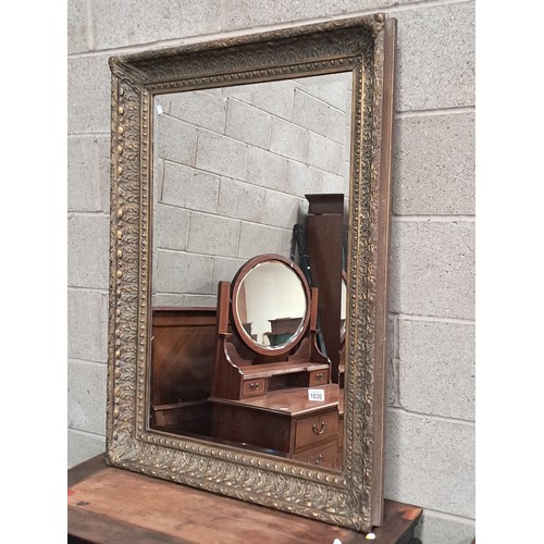 1030 - Large bevelled wall mirror with shabby chic ornate decorative surround 110cm x 79cm