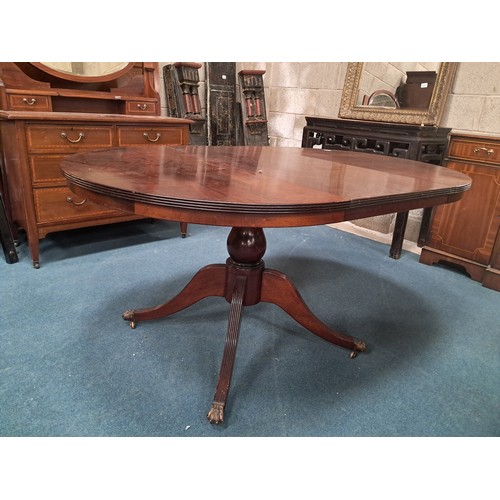 1034 - Regency style Mahogany extending dining table with central pedestal base with reeded legs and brass ... 