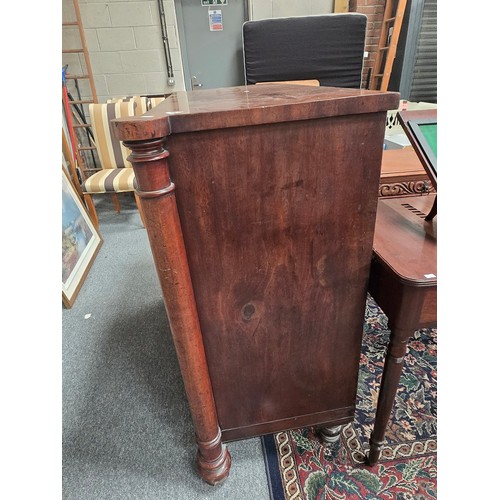 905 - A Victorian Mahogany chest of drawers, two short over three long, with turned column uprights and tr... 