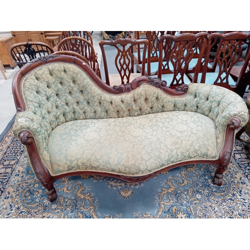 1099 - A reproduction Victorian style chaise longue and matching arm chair