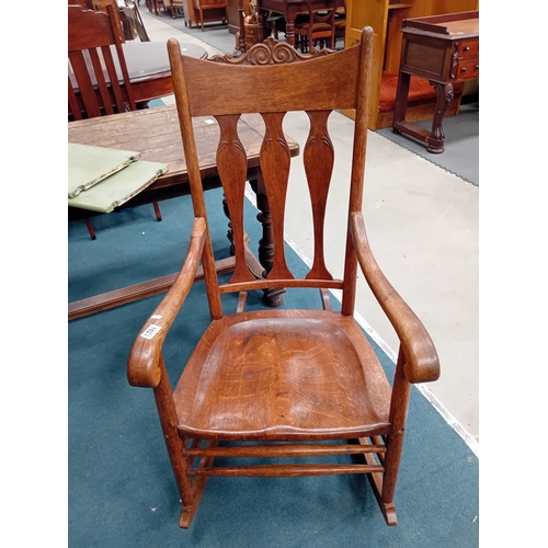 1021 - An American style arts and crafts oak shaker rocking chair.