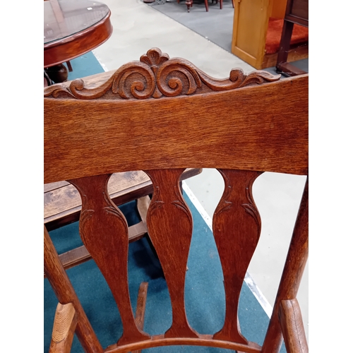 1021 - An American style arts and crafts oak shaker rocking chair.