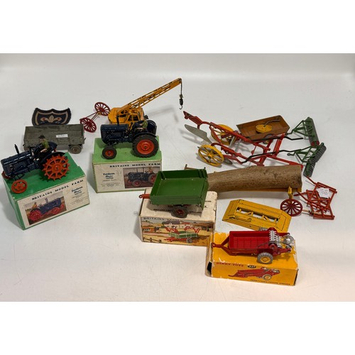 332 - A collection of toy vehicles and figures including Dinky 321 'Massey-Harris Manure Spreader' 27c, in... 