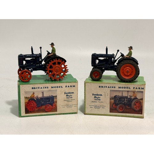 332 - A collection of toy vehicles and figures including Dinky 321 'Massey-Harris Manure Spreader' 27c, in... 