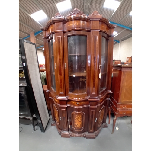 1055 - An Italian style mahogany and marquetry display cabinet.