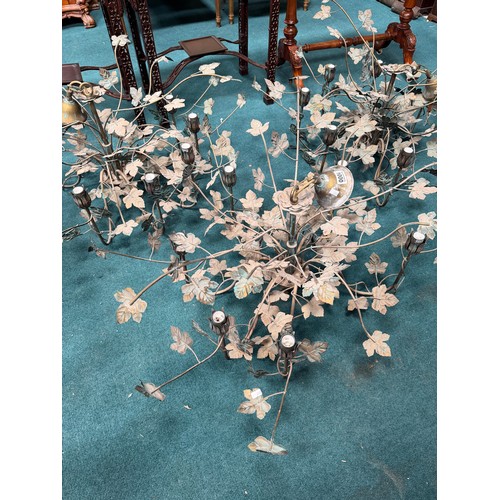 1000 - Three six-light metal leafy branch chandeliers. (3)