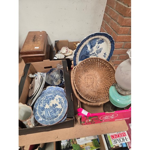 1213 - Three boxes of miscellaneous items including oil lamp, blue and white plates, vintage sewing machine... 