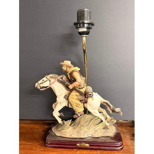 540 - A pair of figural table lamps, Native American chief and Cowboy, 'The Academy Collection', both on h... 