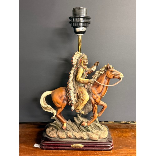 540 - A pair of figural table lamps, Native American chief and Cowboy, 'The Academy Collection', both on h... 
