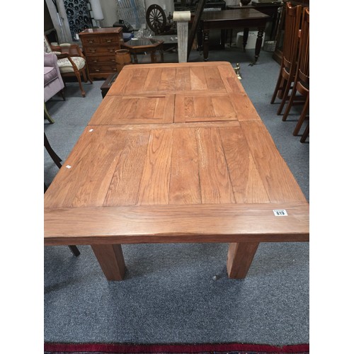 819 - An extendable solid oak dining table W90cm x L140cm (closed) 180cm open