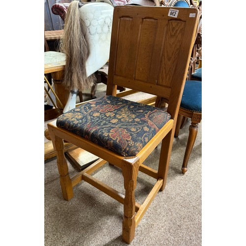 662 - 'Knightman' Family, Old Mill Furniture, an oak dining chair with panel back and drop-in upholstered ... 