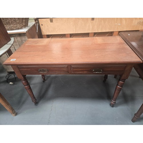 1080 - A Georgian Side table with two drawers on castors