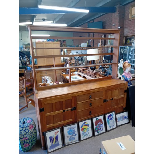 639 - Trevor Hutchinson, a Squirrelman oak dresser and plate rack, adzed, with two cupboards and four draw... 