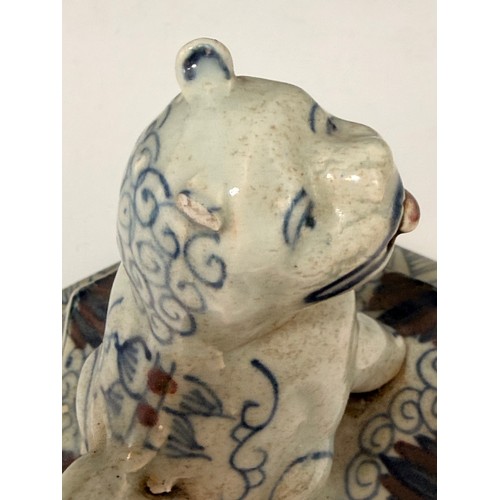 9 - A pair of Chinese porcelain Hexagonal temple jars with kylin shaped handles and lids. An ear is miss... 