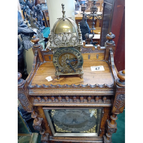 47 - Arts & Crafts Mahogany Mantel Clock with a heavily carved case.  Silver chapter ring with Roman nume... 
