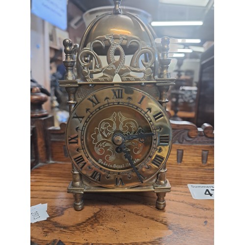 47 - Arts & Crafts Mahogany Mantel Clock with a heavily carved case.  Silver chapter ring with Roman nume... 