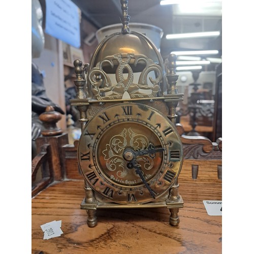 47 - Arts & Crafts Mahogany Mantel Clock with a heavily carved case.  Silver chapter ring with Roman nume... 