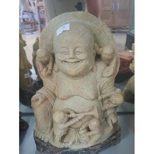 217 - A collection of oriental soapstone carvings including figural models, three Buddha figures, a boat, ... 