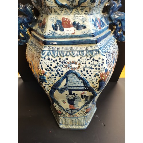 9 - A pair of Chinese porcelain Hexagonal temple jars with kylin shaped handles and lids. An ear is miss... 
