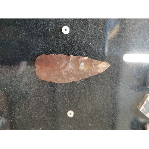 12 - A framed display containing Native American Anasazi pottery shards and some stones. H