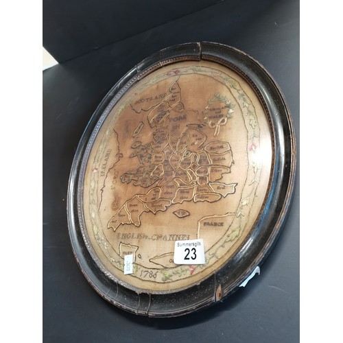23 - George III oval needlework map sampler of England and Wales dated 1786.  H 36cm W 33cm.